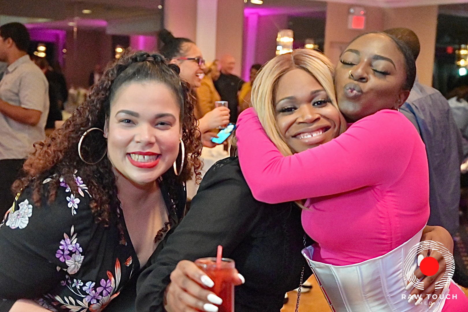 Friends enjoying an event; original Raw Touch Media watermark preserved